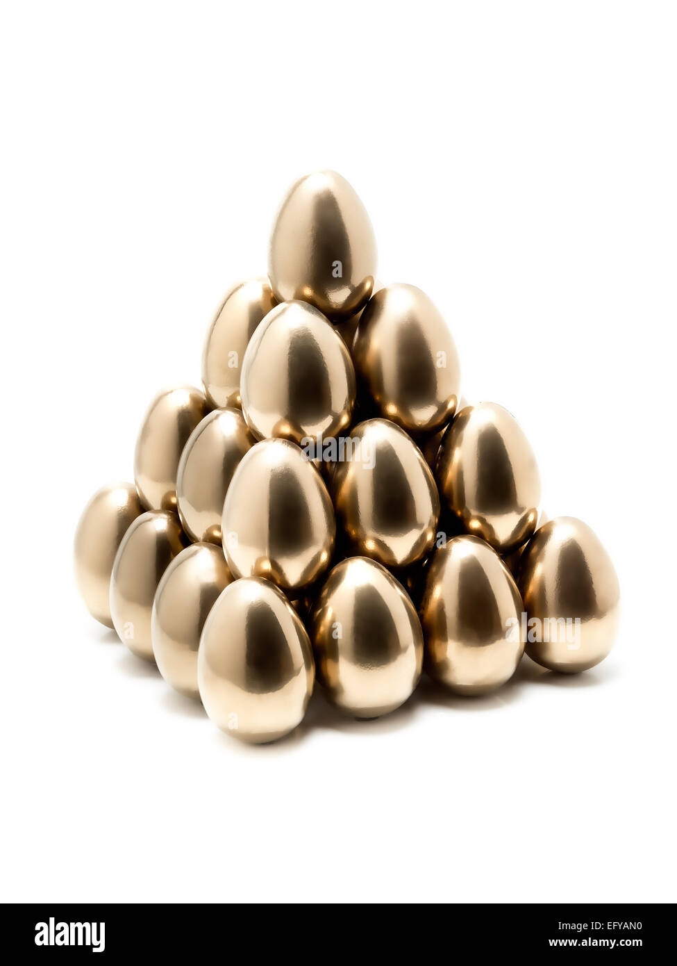 Pyramid of golden eggs on white background Stock Photo