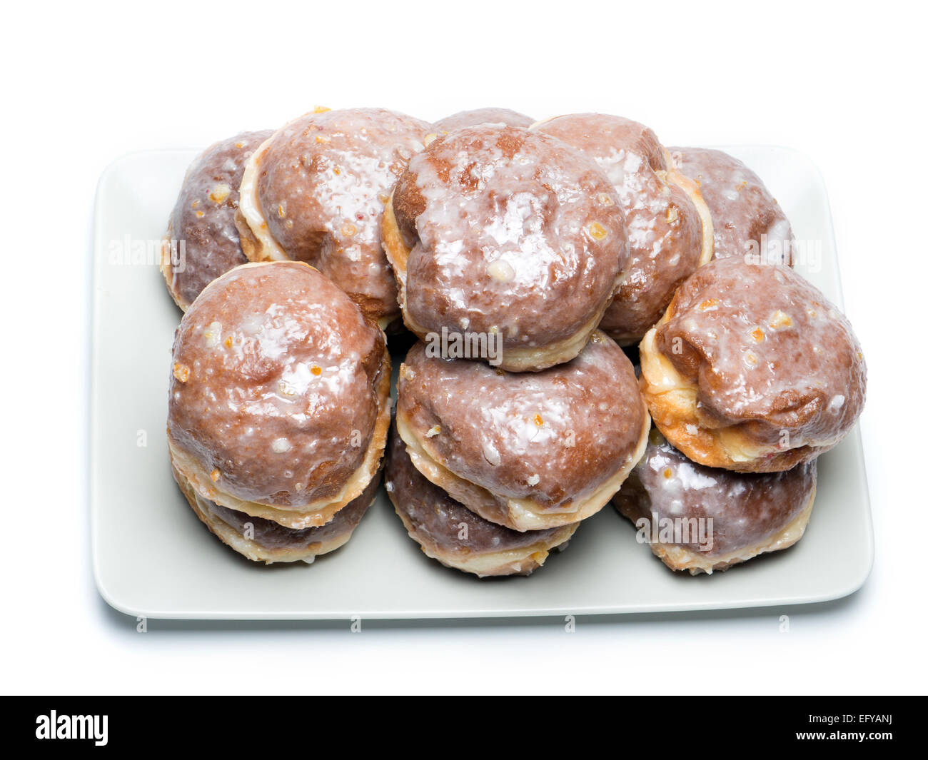 Polish donuts on plate shot on white Stock Photo