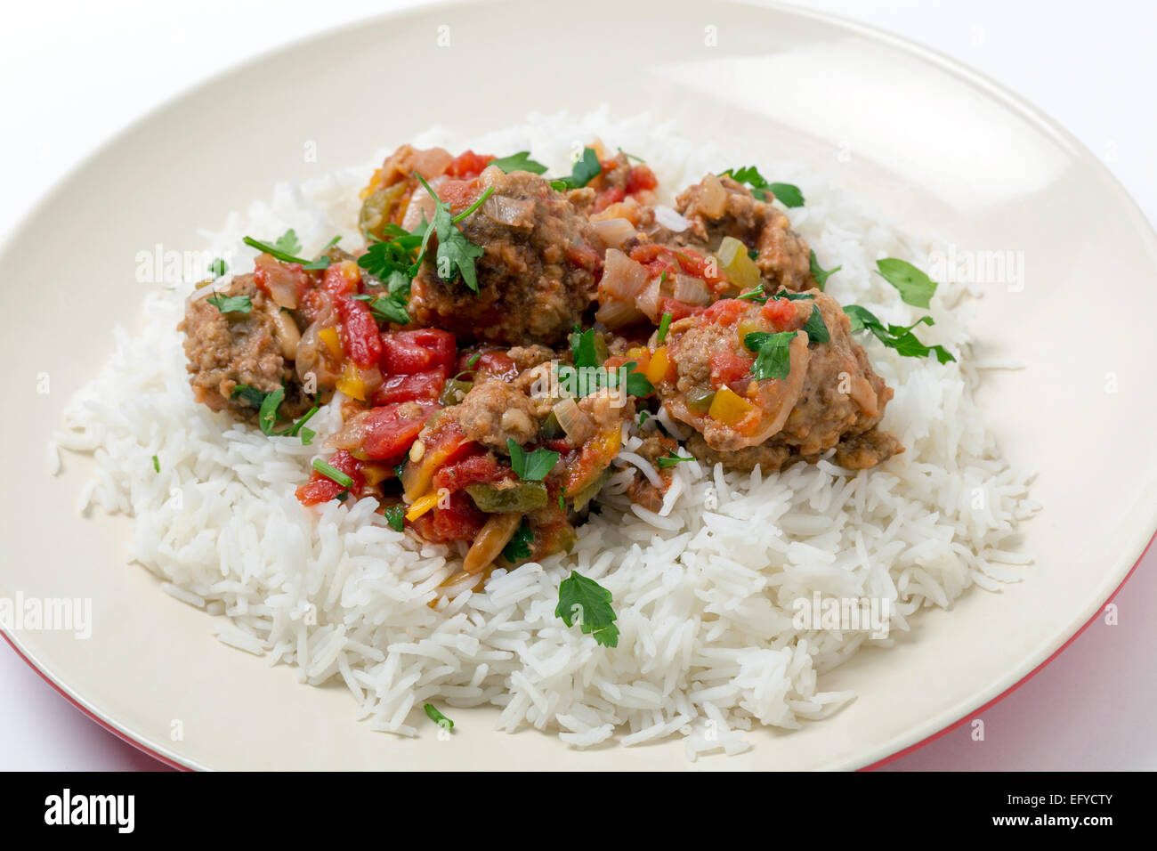 Meatballs Smyrna  cooked with a sauce of cumin, red and yellow capsicums and tomatoes, making a colourful and tasty dish Stock Photo