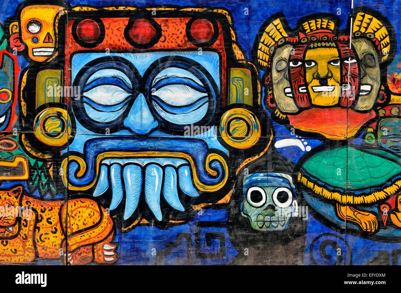 Masks, graffiti painting on a hoarding, Mexico City, Mexico Stock Photo