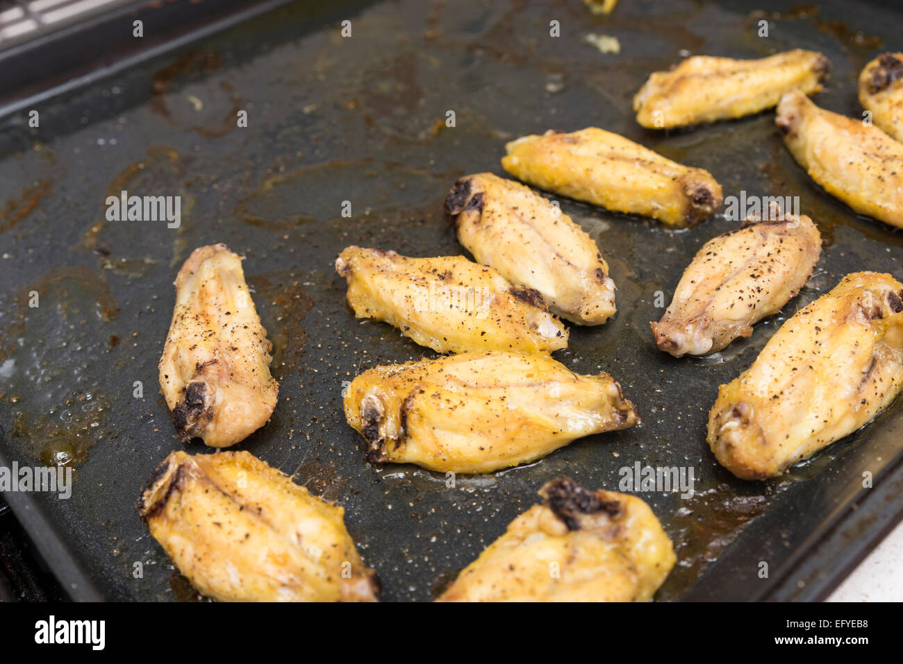 chicken wings on black tray Stock Photo