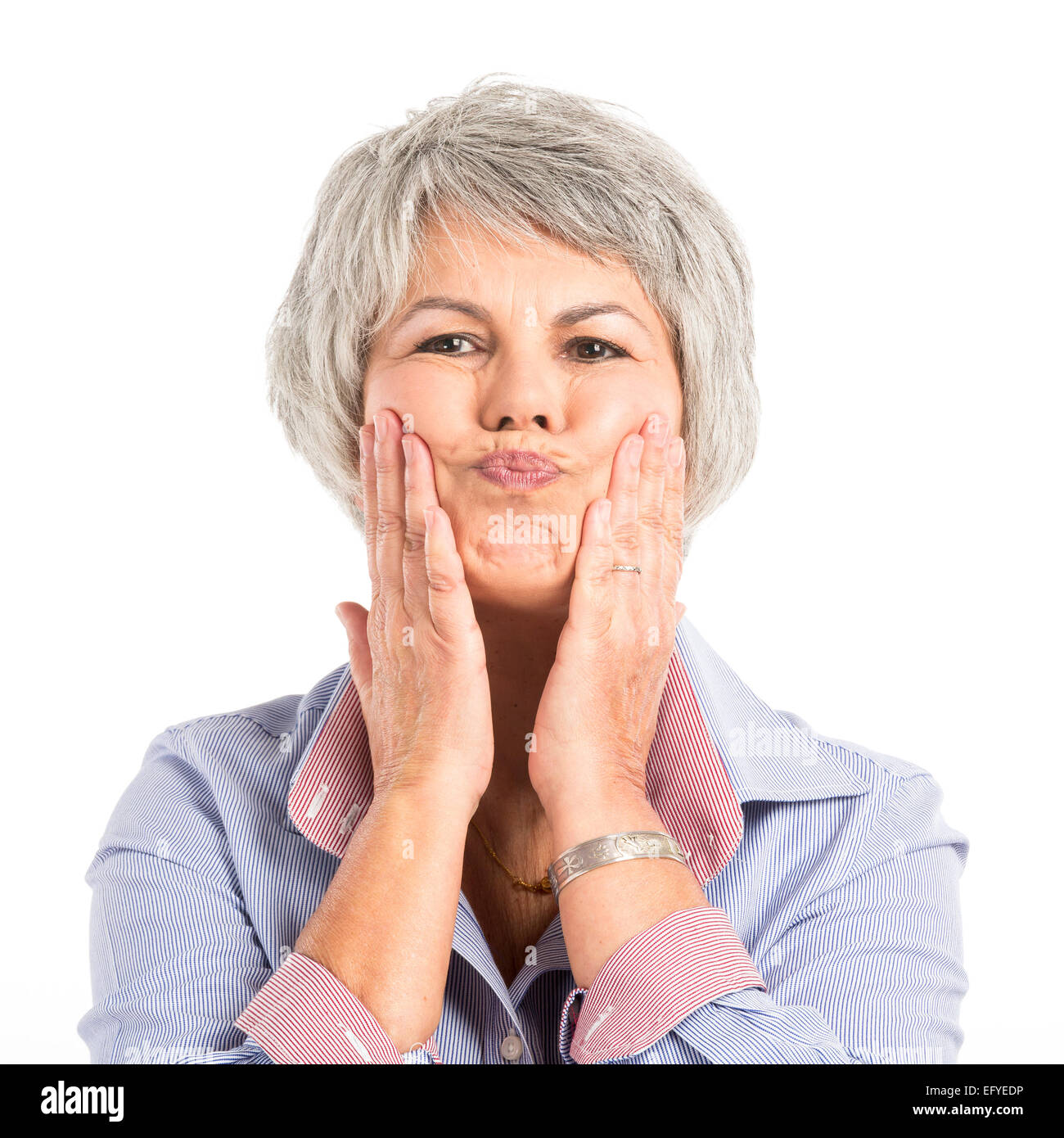 Portrait of a elderly woman making a funny face Stock Photo