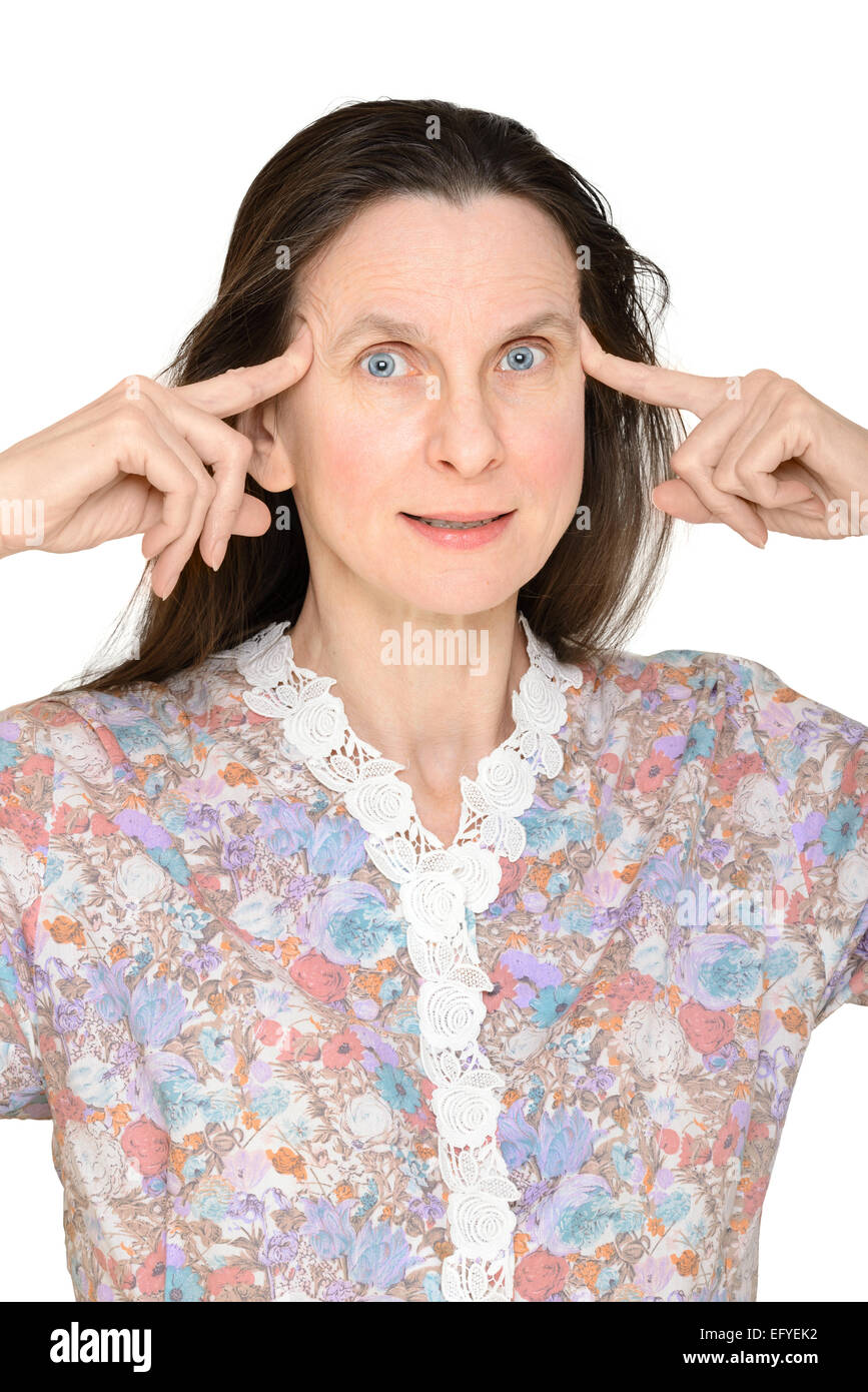 An astonished adult woman with the fingers on the temple, has just got an unbelievable idea Stock Photo
