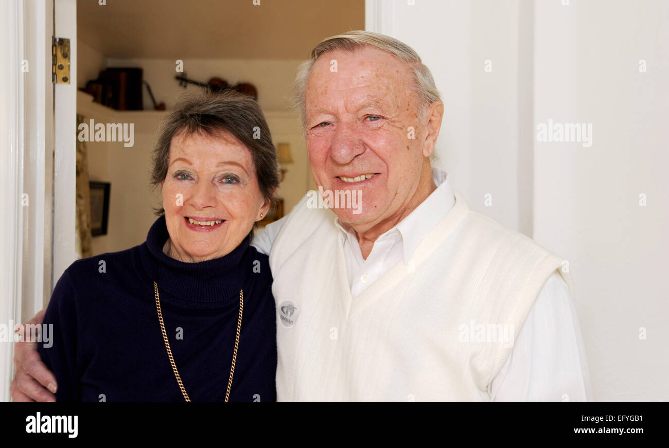 Elderly pensioners couple male and female in their 80s still in love looking happy and smiling Stock Photo