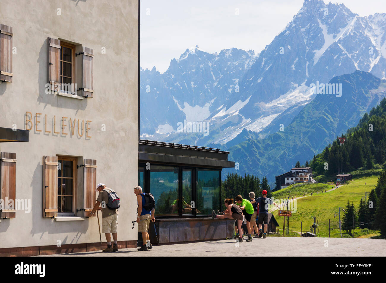 Walkers at the Bellevue Hotel with Aiguille du Midi behind, Chamonix, French Alps, Rhone Alps, France Stock Photo