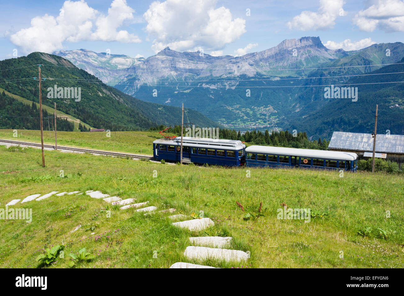 The Mont Blanc mountain cog train with Servoz village below, at Les