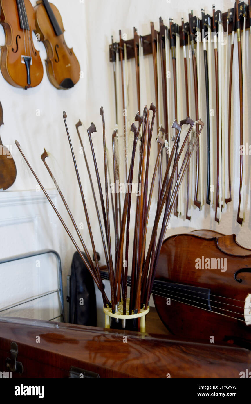 Violin bows and violins at the workshop of Peter Ratcliff in Brighton Stock Photo