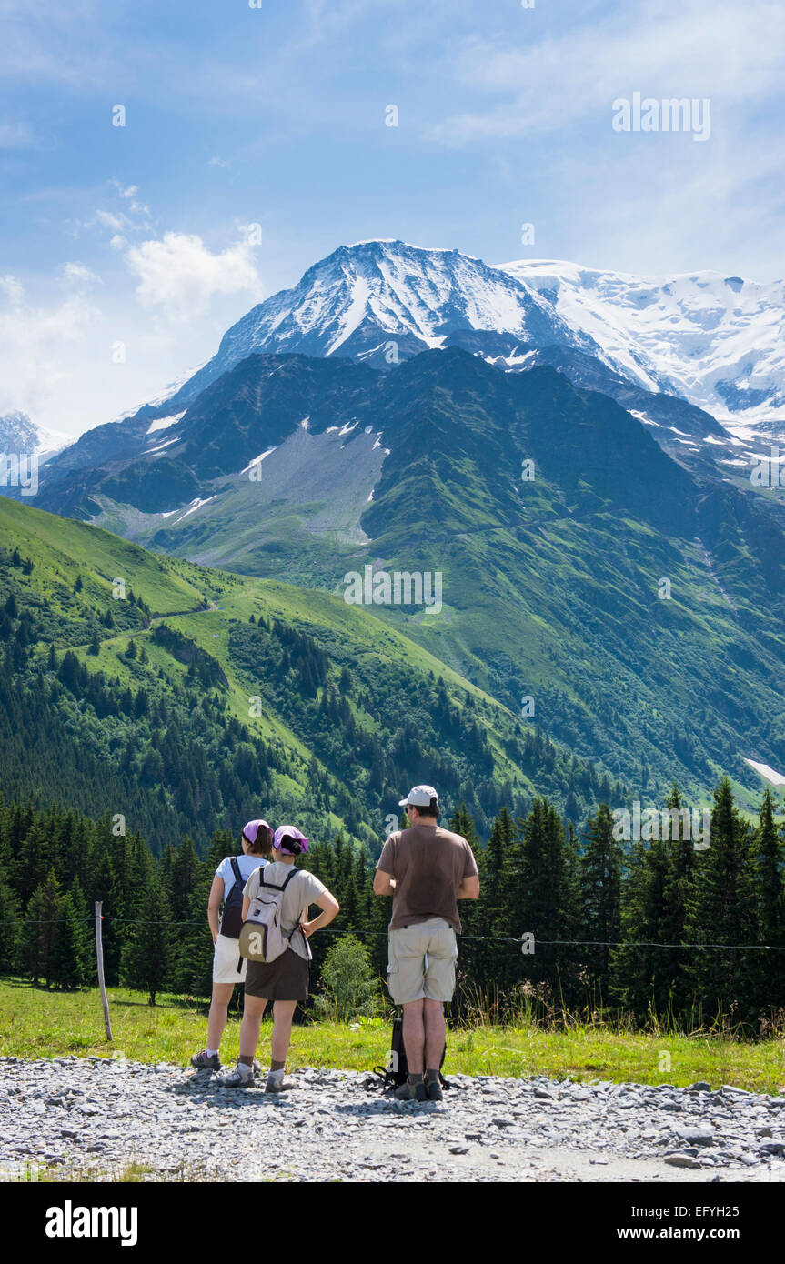 Hikers hiking in summer at Aiguille du Gouter on Mont Blanc mountain with people walking in the French Alps, France, Europe Stock Photo