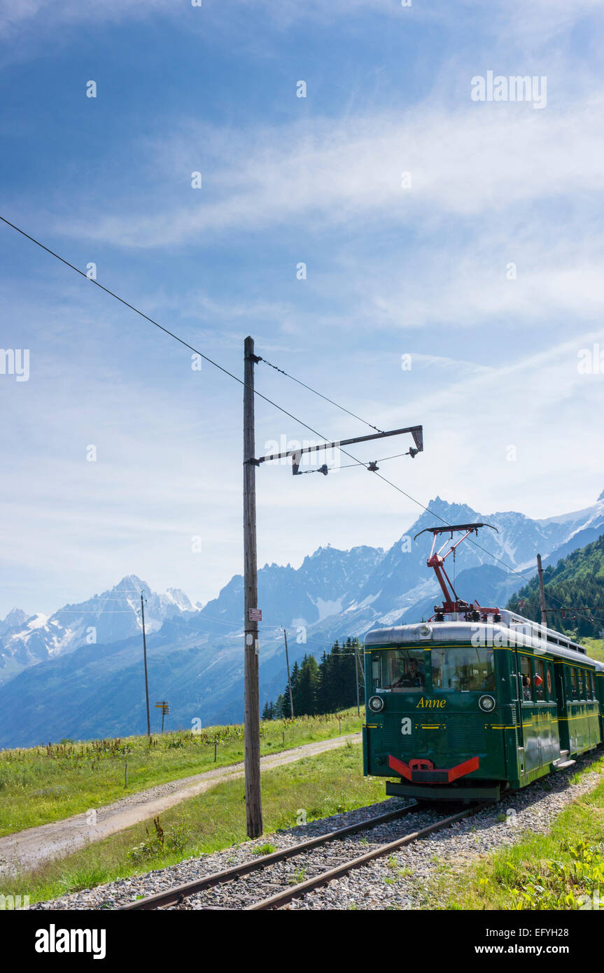 The Mont Blanc mountain cog train with the Aiguille du Midi behind, at Bellevue, near Chamonix, French Alps, France Stock Photo