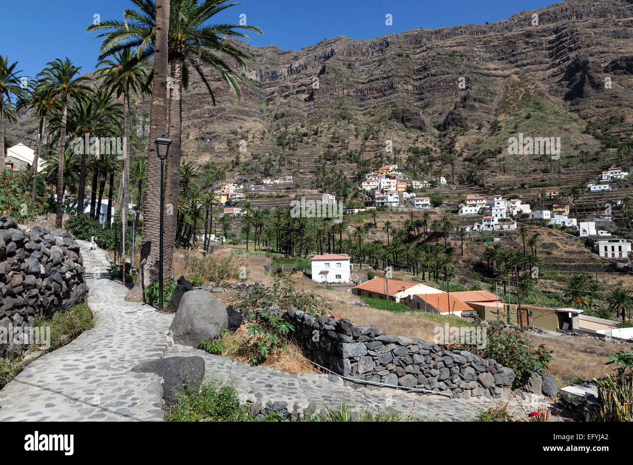 Paths connecting the villages in the upper Valle Gran Rey, La Vizcaina behind, La Gomera, Canary Islands, Spain Stock Photo