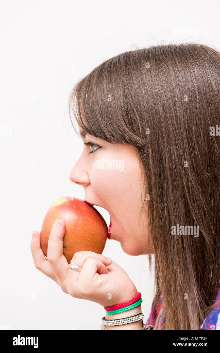 pretty woman eating an apple Stock Photo