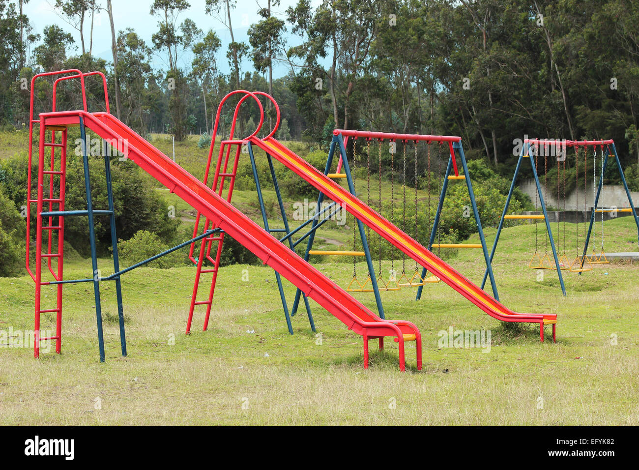 Slides And Swings In A Childrens Playground In A Park In Cotacachi