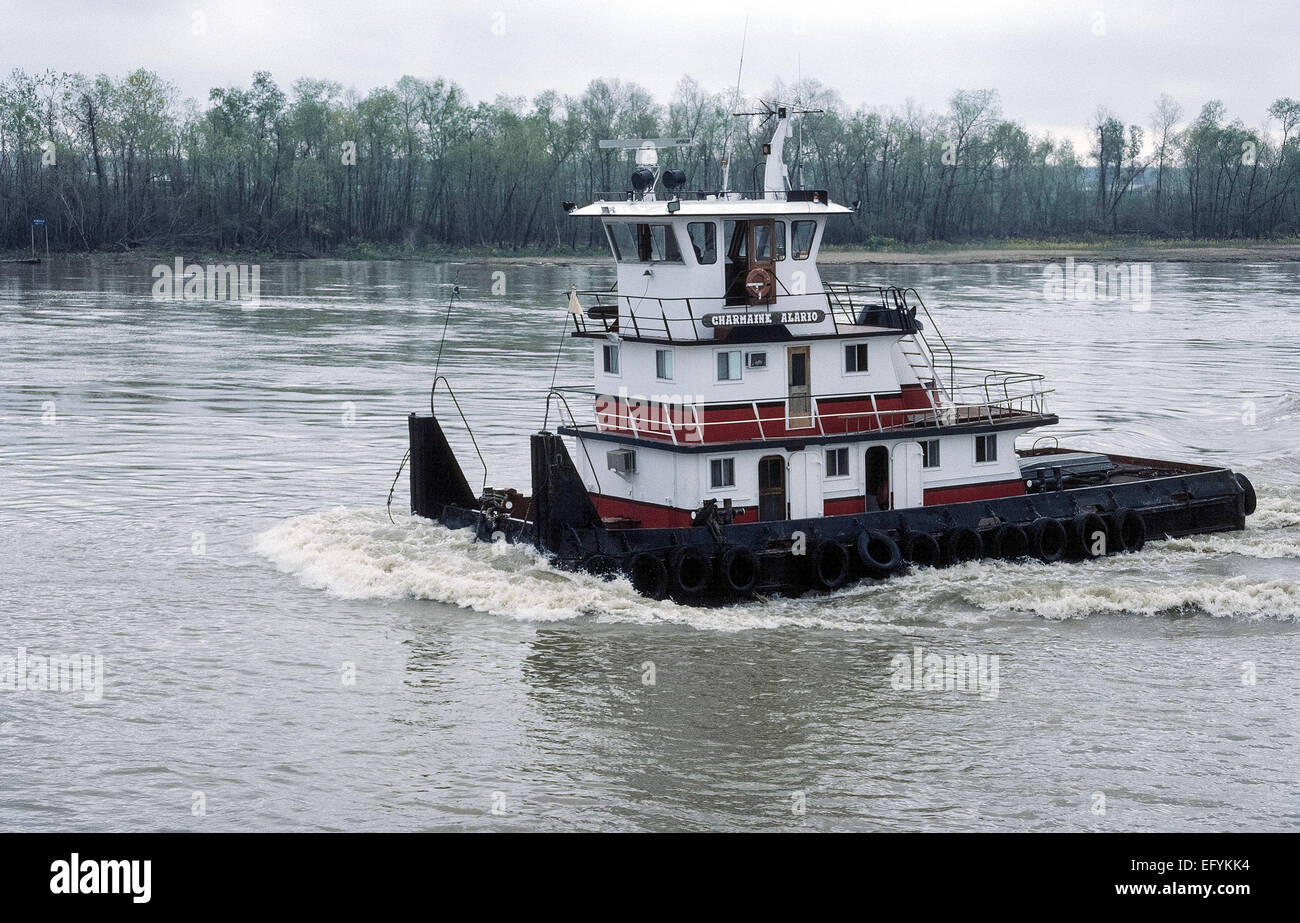 A type of towboat called a pusher, pusher boat or pusher tug is used to push cargo barges on the Mississippi River in the USA. Stock Photo