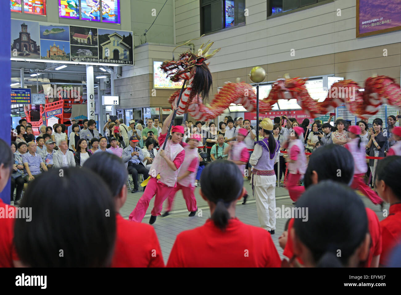 Japanese high school girls performing a Chinese Dragon Dance ceremony. Stock Photo