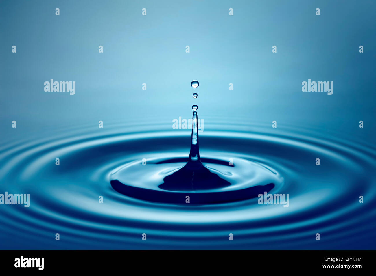 Water Drop Splash (Shallow DOF with focus on top drop) Stock Photo