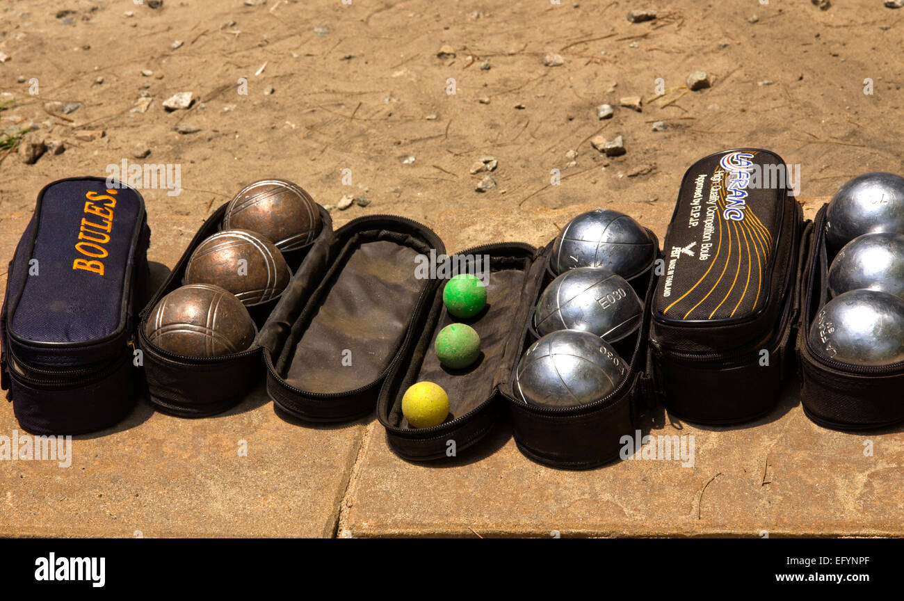 Boules with cases on a sandy area in a hotel. Stock Photo