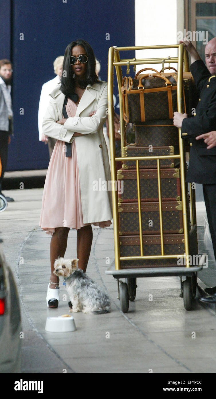 Naomi Campbell With dog and louis vuitton designer luggage at The  Dorchester Hotel London set of 6 Stock Photo - Alamy
