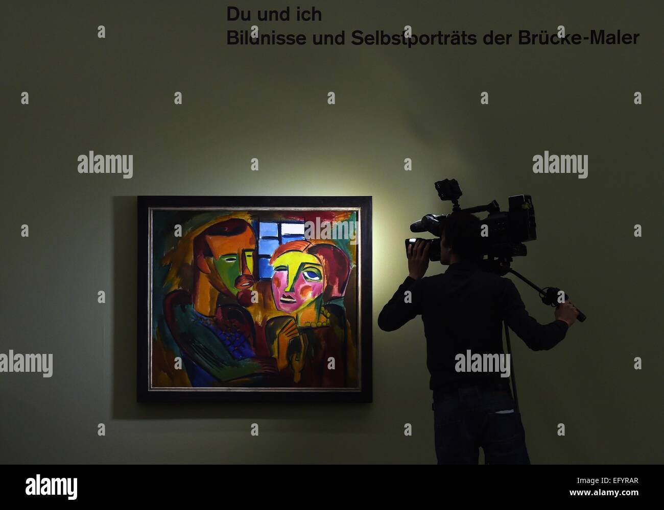 A camera man films the painting 'Du und ich' (you and me) from 1919 by artist Karl Schmidt-Rottluff during a preview tour of the Moritzburg art museum in Halle, Germany, 12 February 2015. The exhibition showcases 70 works of art of various artists of the artist group 'The Bridge'. Photo: Hendrik Schmidt/ZB Stock Photo