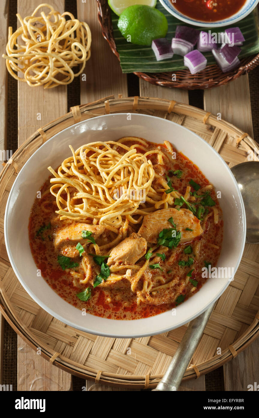 Khao soi. Coconut and curry flavored noodles. Northern Thailand Stock Photo