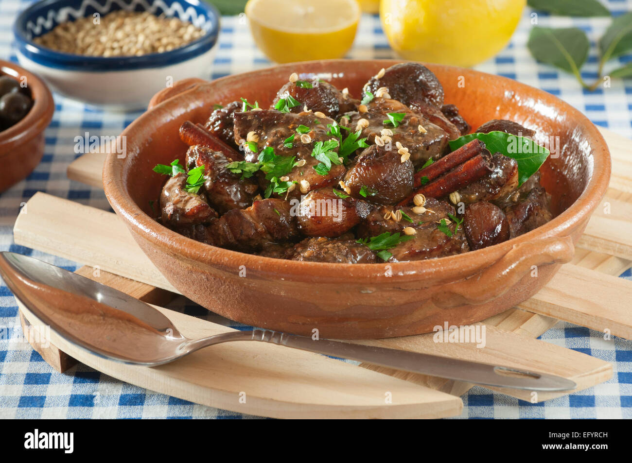 Afelia. Pork with red wine and coriander seed. Stock Photo