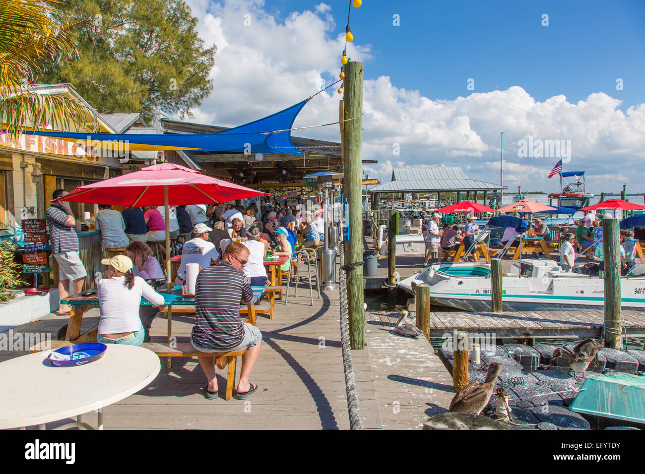 Outdoor dinning on the dock at Star Fish Company Dockside Restaurant in Cortez Florida Stock Photo