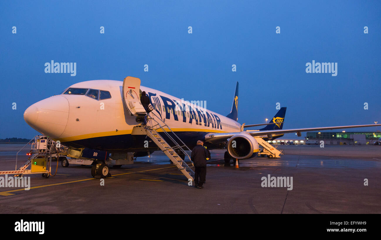 Passengers boarding a Boing 737-800 of Ryanair at London Stansted Airport early in the morning. Stock Photo