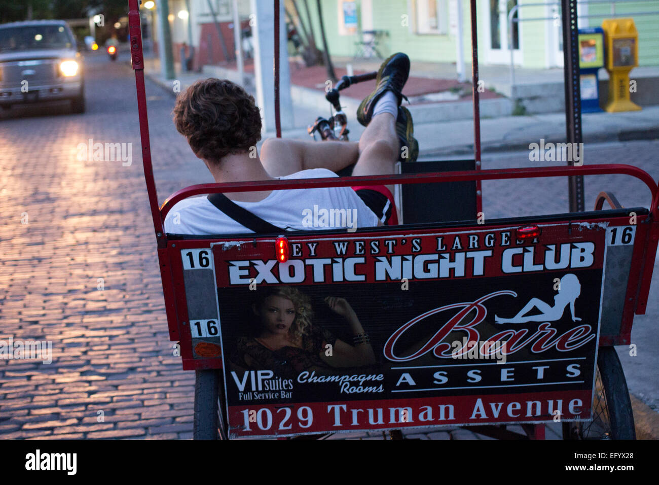 Young man sleeping in a rickshaw in Key West Florida USA Stock Photo