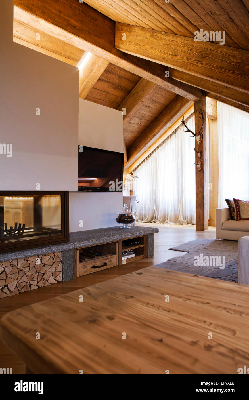 Luxury mountain cottage with fireplace sofa living room Stock Photo