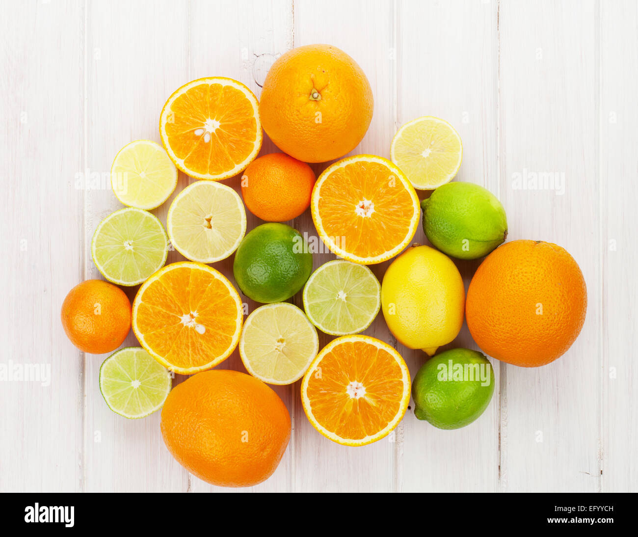 Citrus fruits. Oranges, limes and lemons. Over wooden table background Stock Photo