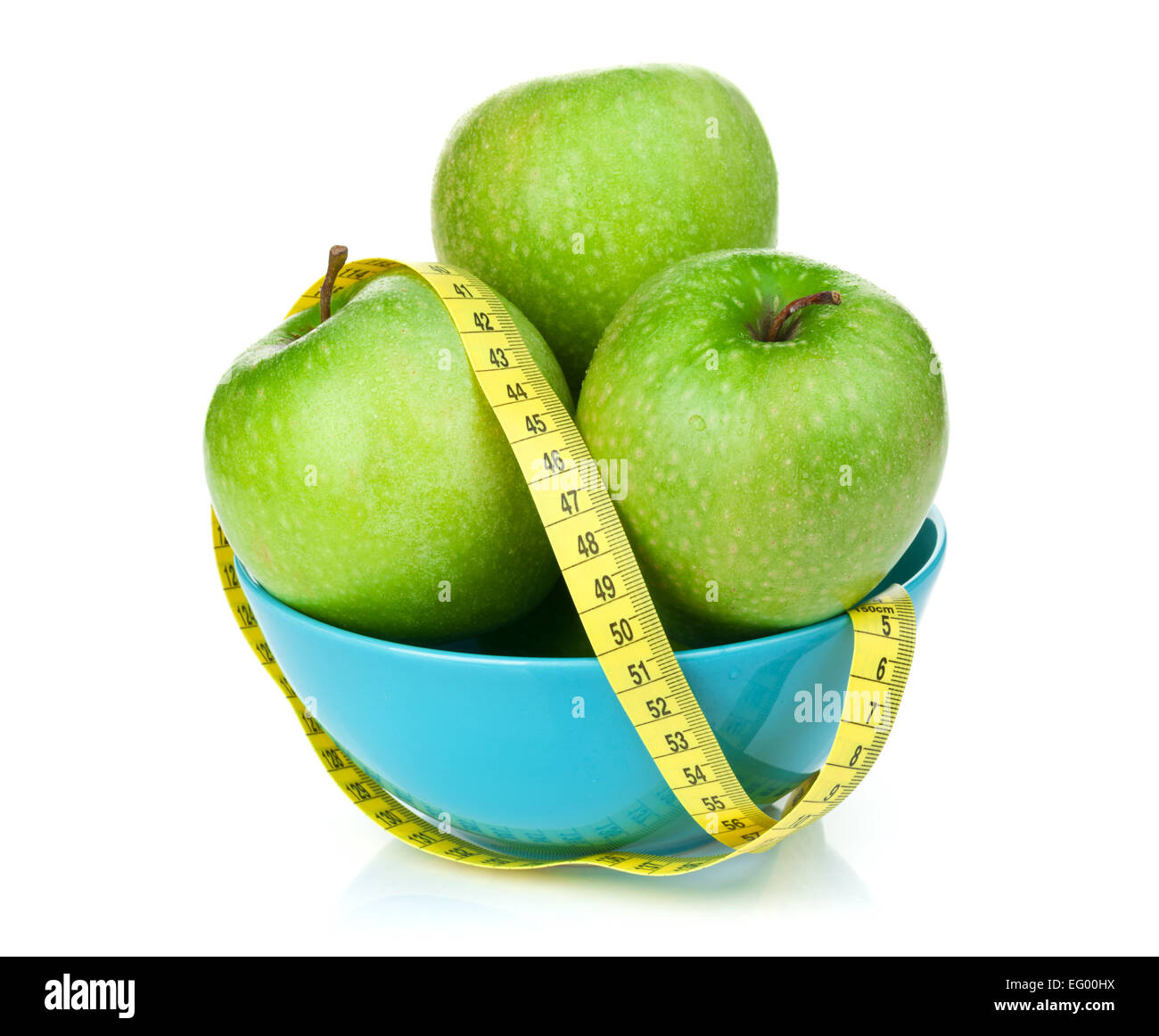 Fresh green apples with yellow measuring tape. Healthy food. Isolated on white background Stock Photo