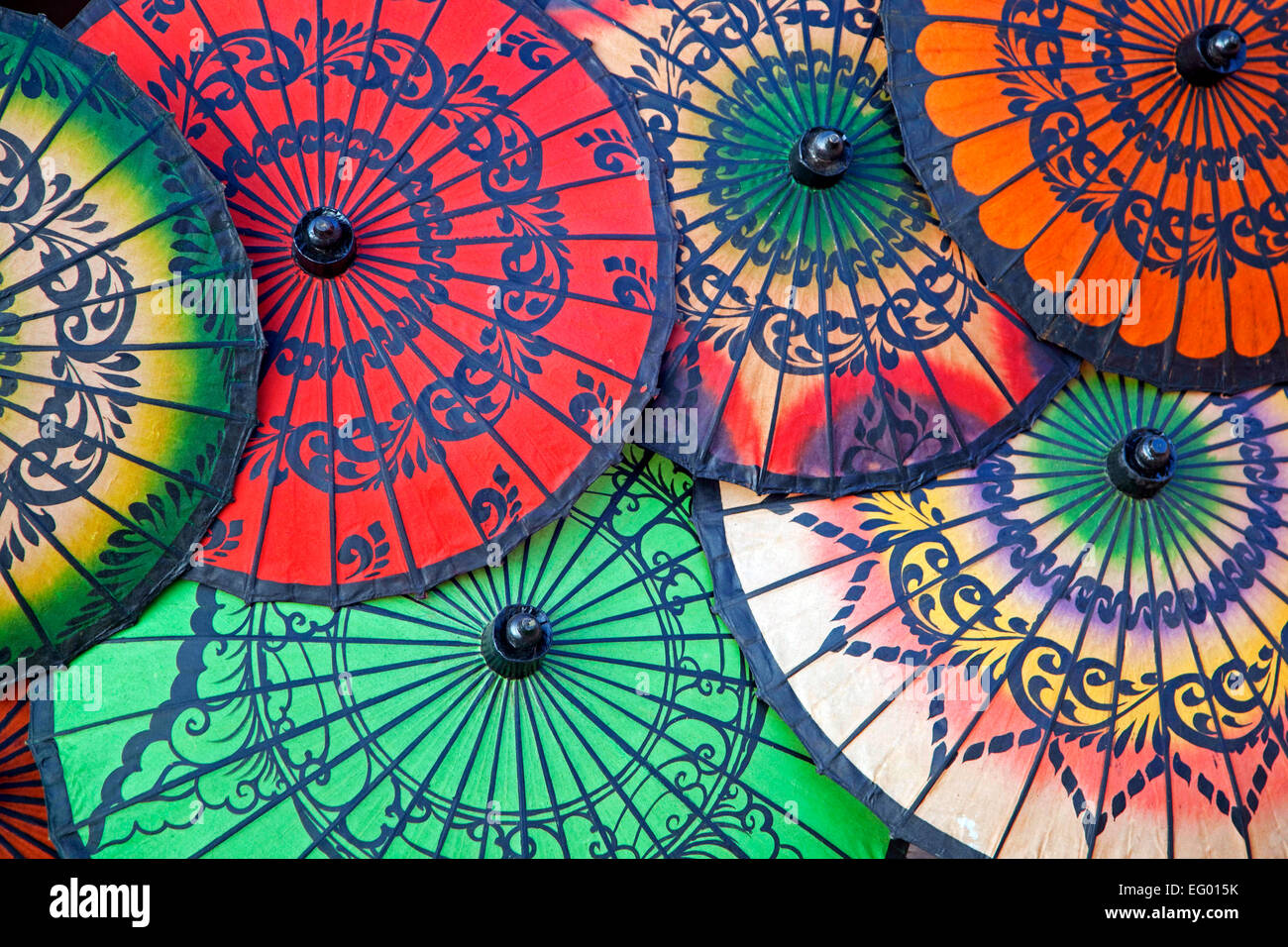 Asian colourful opened oil-paper parasols / umbrellas at souvenir shop in Myanmar / Burma Stock Photo