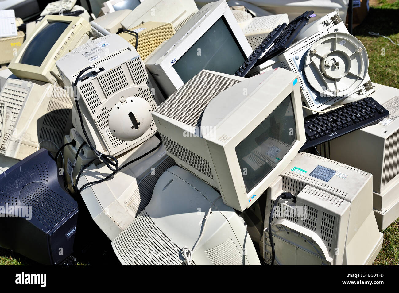 Pile of old computer monitors and keyboards Stock Photo