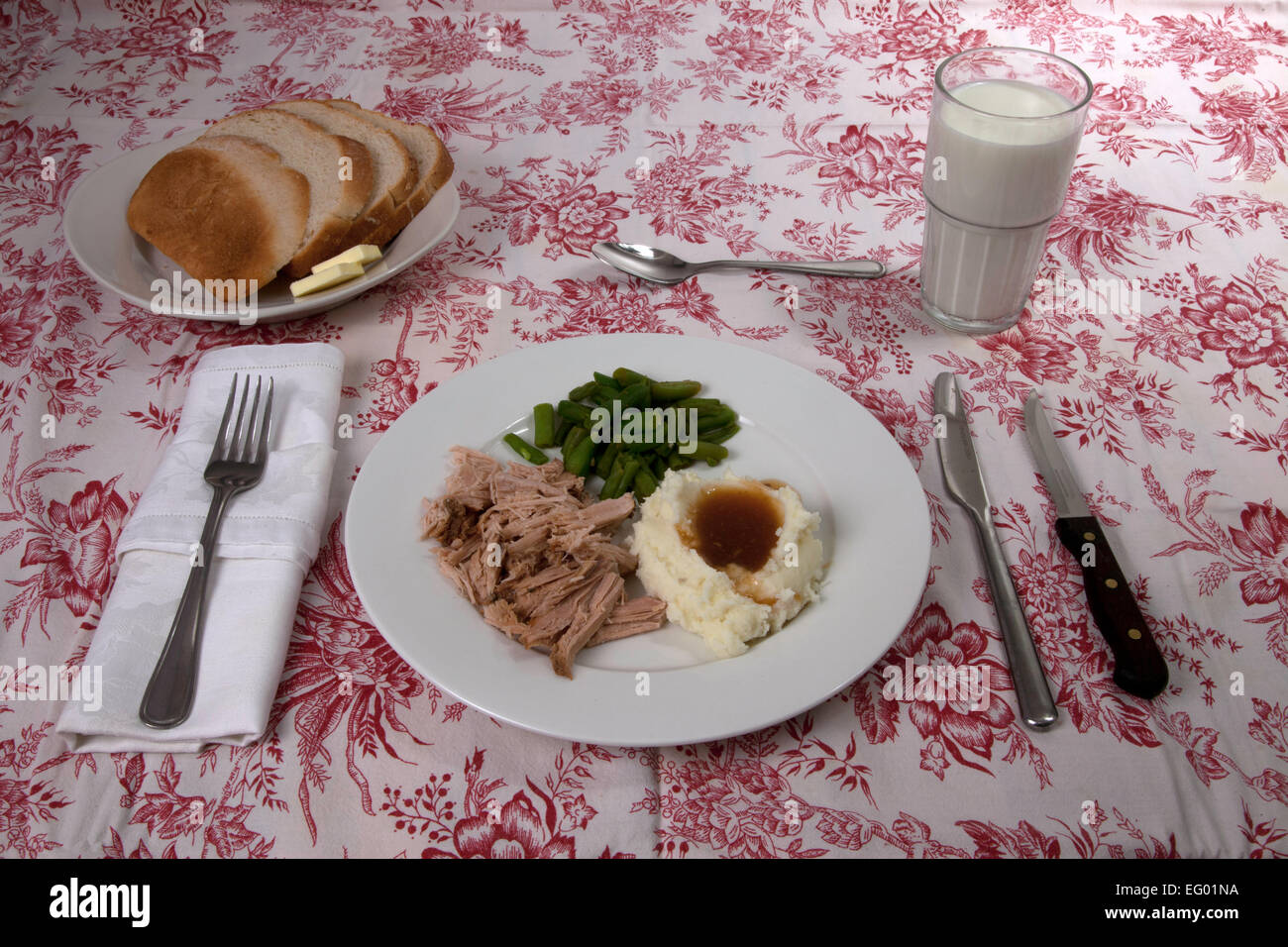 A pork roast dinner with sides and milk Stock Photo Alamy
