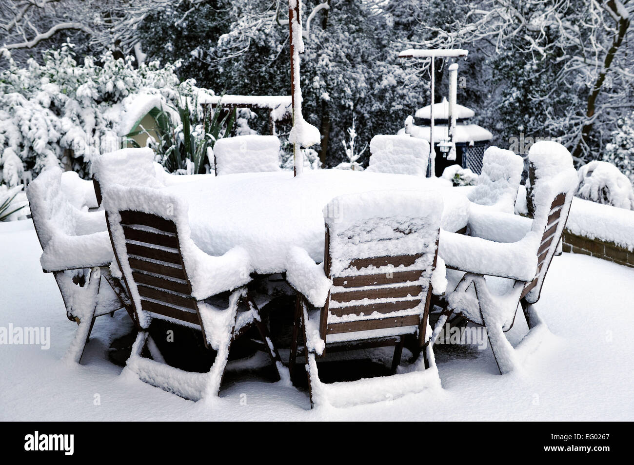 snow covered garden furniture England Stock Photo Alamy