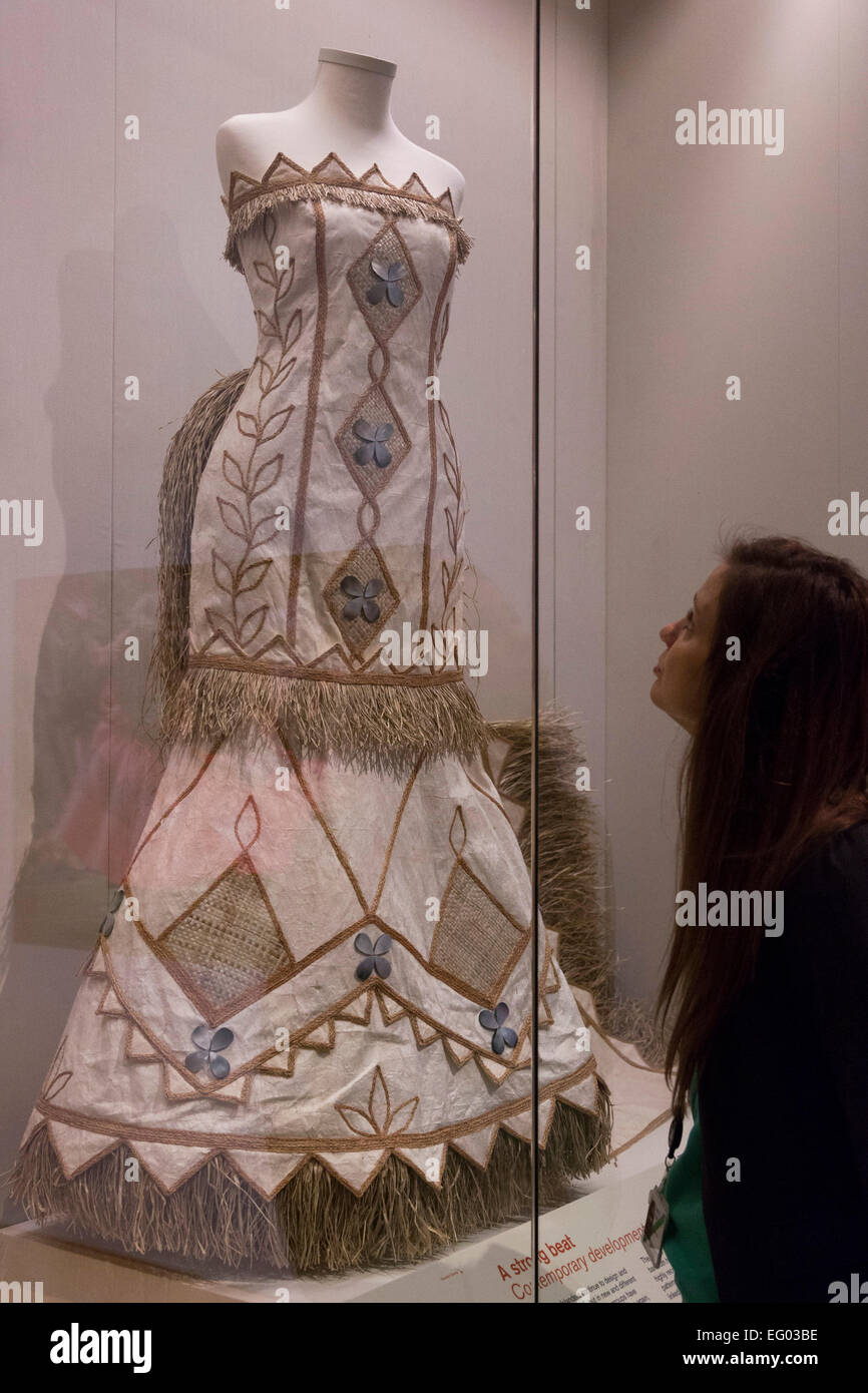 A Visitor To The Exhibition Looks At A Wedding Dress Made Of Stock
