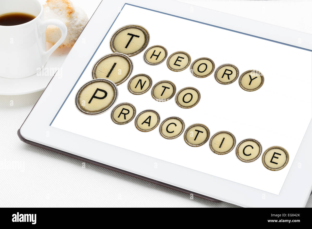 TIP (theory into practice) acronym explained with old typewriter keys on a digital tablet with a
