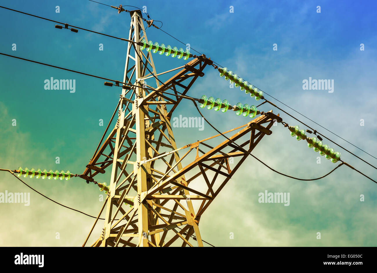 High voltage electric tower against the blue sky Stock Photo - Alamy