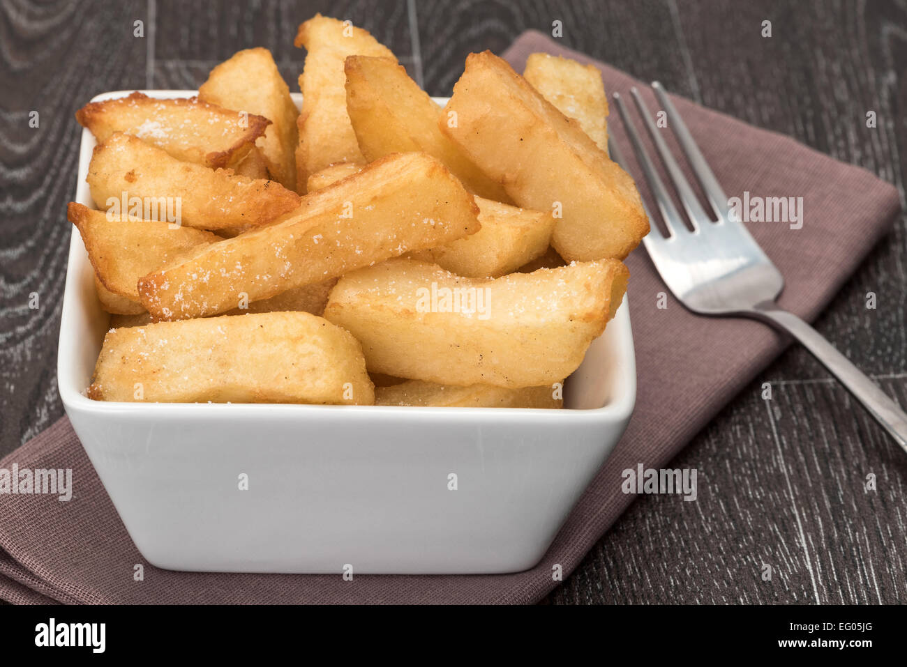 Close-up of a bowl of chunky fries or potato chips - studio shot Stock Photo