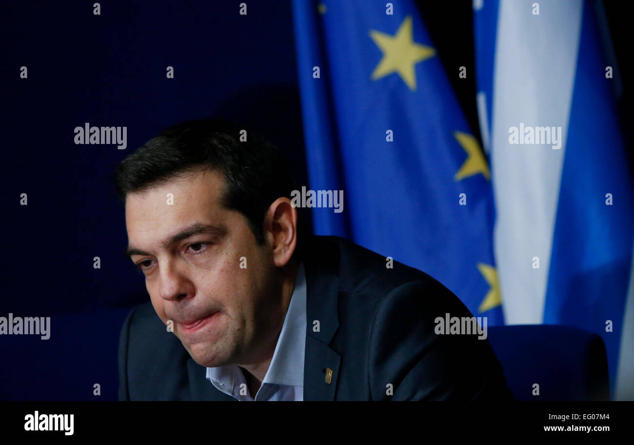 Brussels, Belgium. 12th Feb, 2015. Greek Prime Minister Alexis Tsipras speaks during a press conference after the European Union (EU) summit in Brussels, Belgium, on Feb. 12, 2015. Greece will not sign a renamed bailout program, Greek government spokesman Gavriil Sakellaridis said on Thursday, a few hours after the failure to reach a joint statement at a euro group meeting in Brussels on the Greek debt crisis. Credit:  Zhou Lei/Xinhua/Alamy Live News Stock Photo