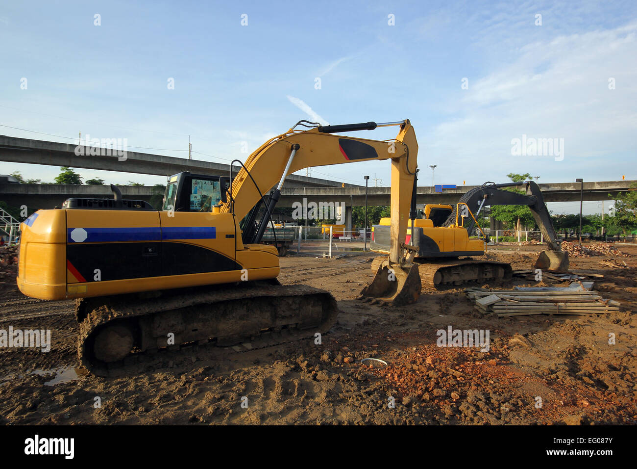 excavator and backhoe on construction site Stock Photo - Alamy