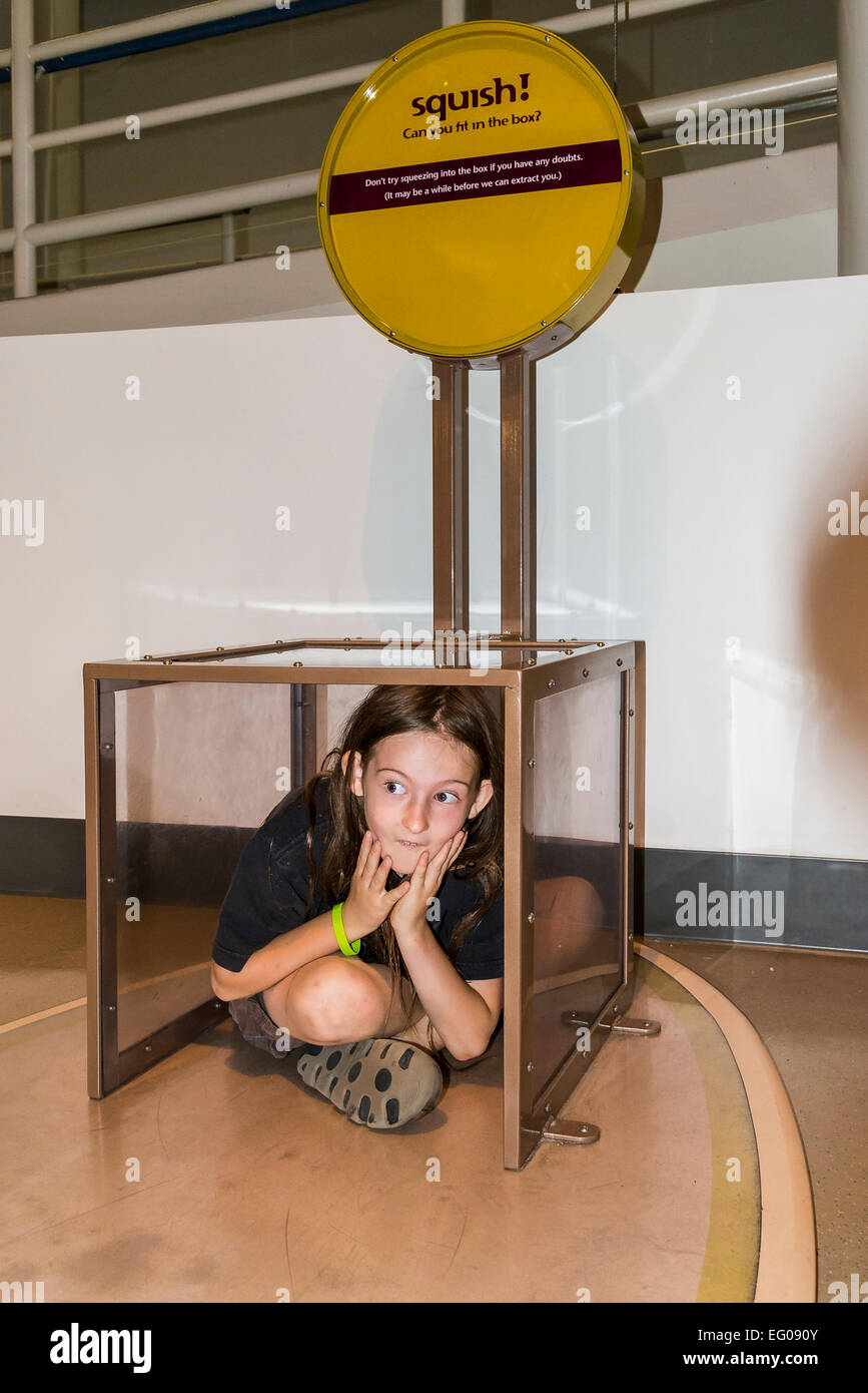 Boy interacting with box display at Telus, World of Science, Vancouver, British Columbia, Canada  (model released) Stock Photo