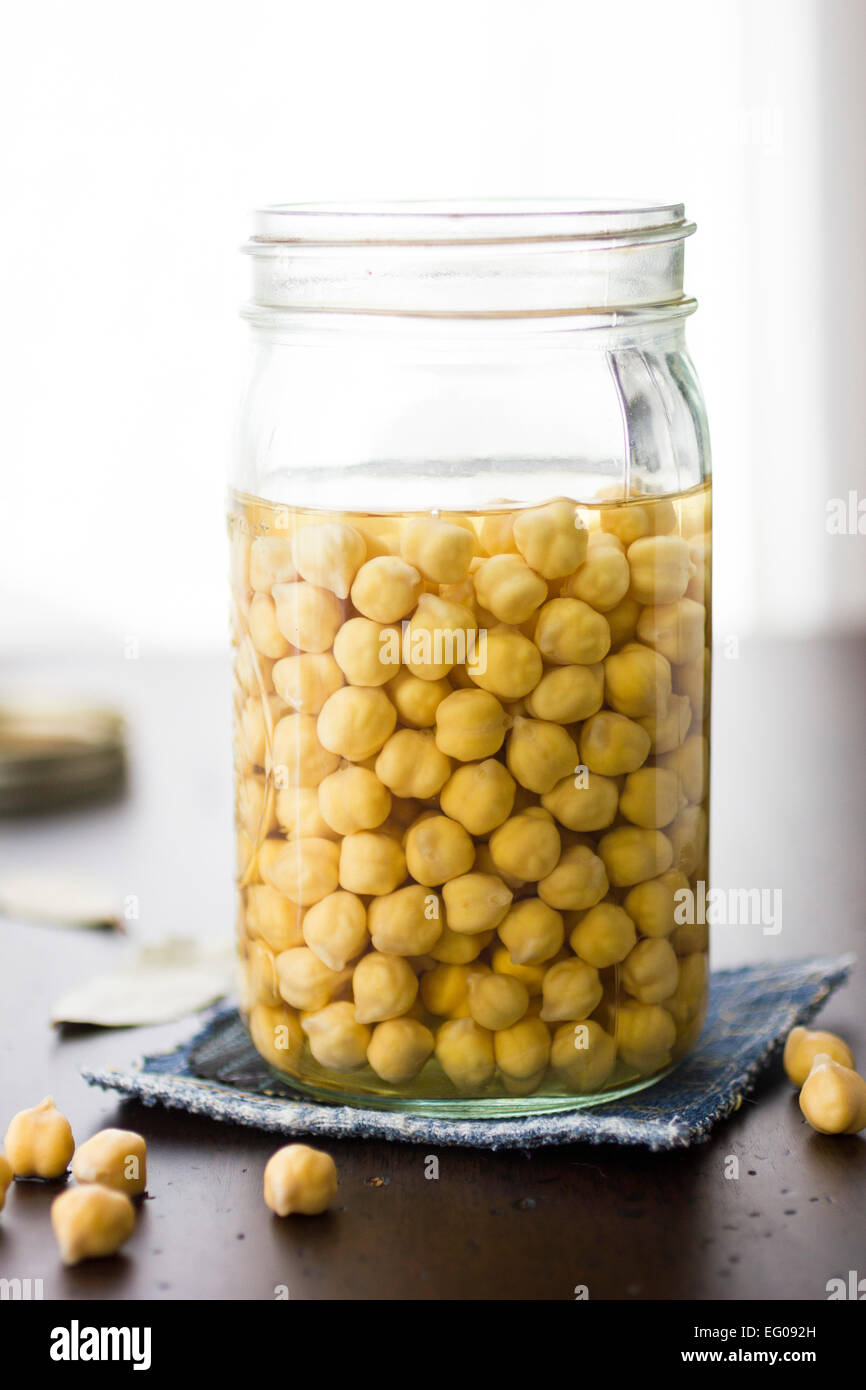 Chickpeas soaking in a jar Stock Photo