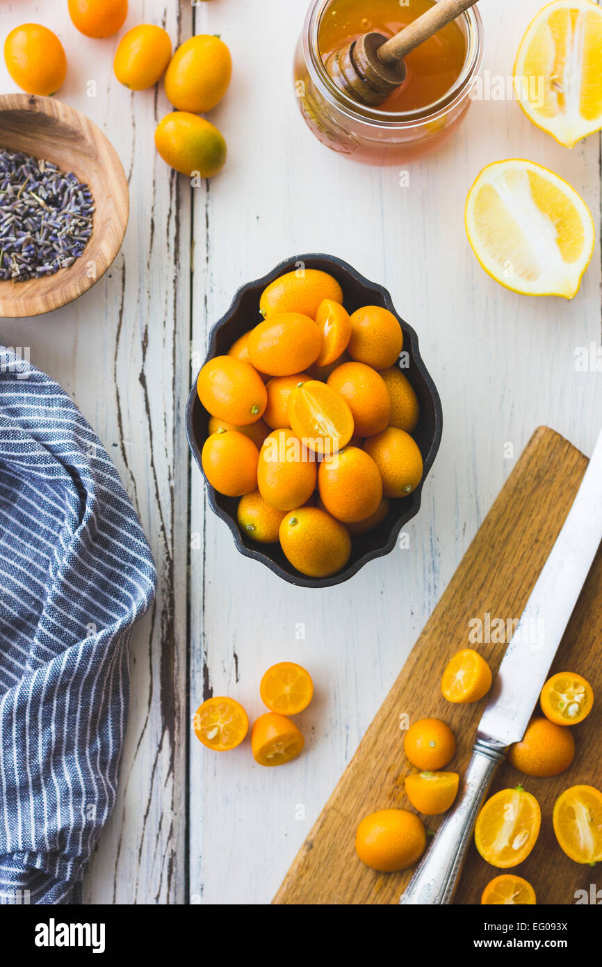 Kumquats, lemon, lavender and honey cooking ingredients Stock Photo