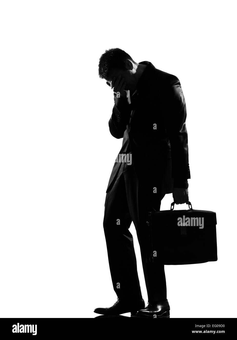 silhouette caucasian business man  expressing fatigue despair tired behavior full length on studio isolated white background Stock Photo