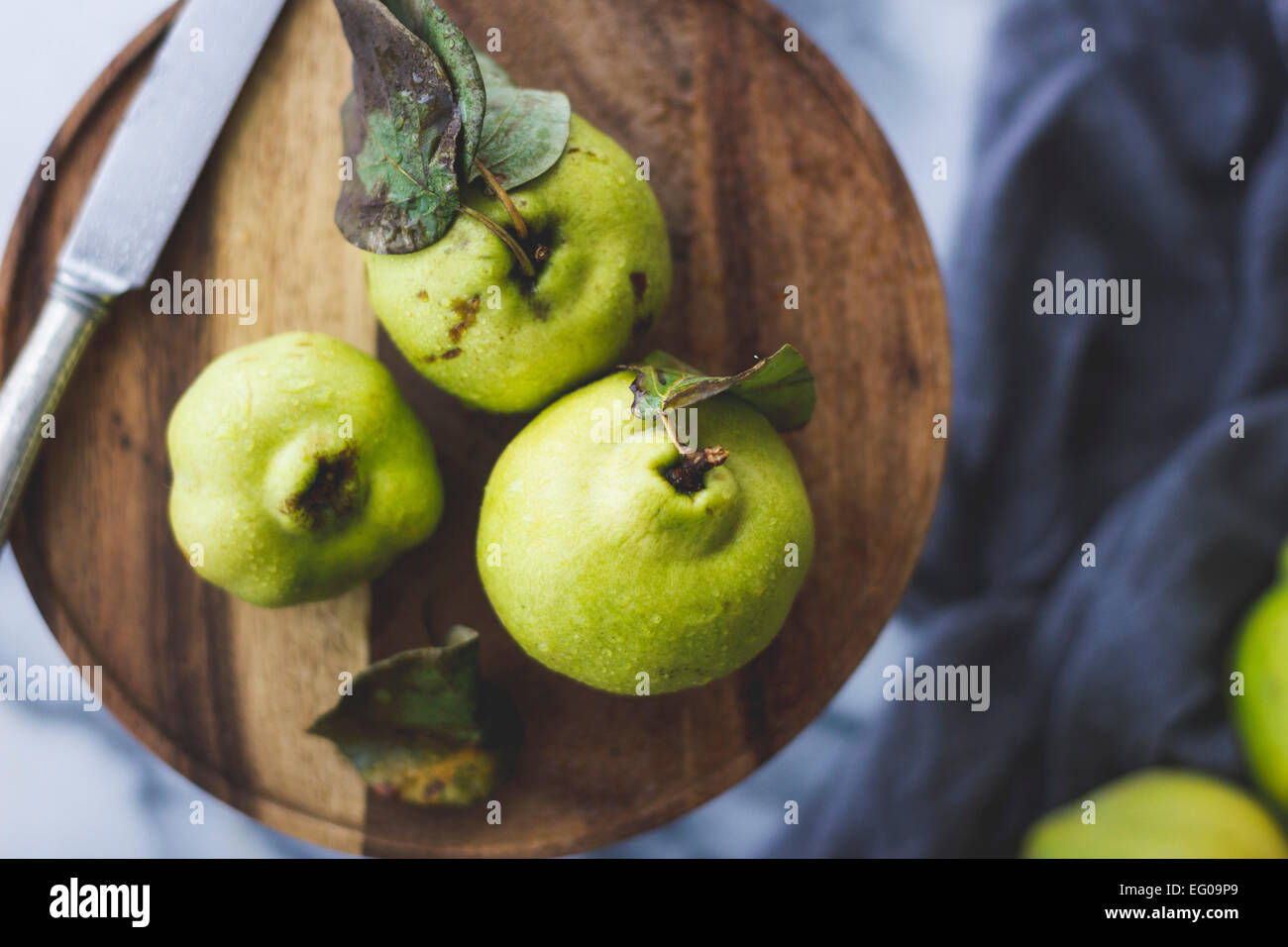 Quince fruit on a chopping board Stock Photo