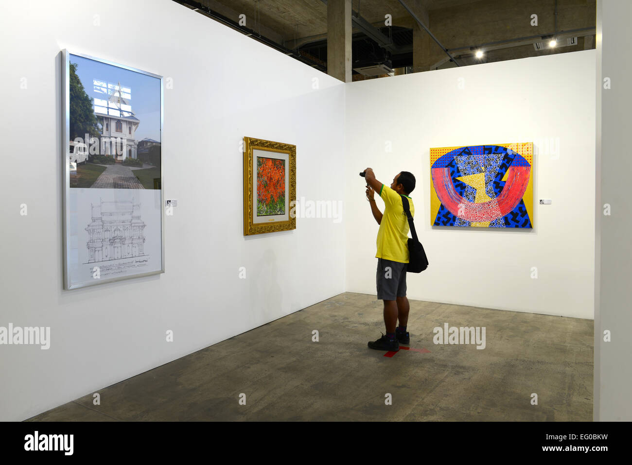 BANGKOK - JANUARY 16: Visitors are shooting the arts in Contemporary Art Exhibition by Kamol Tassananchalee & Friends 71 years a Stock Photo