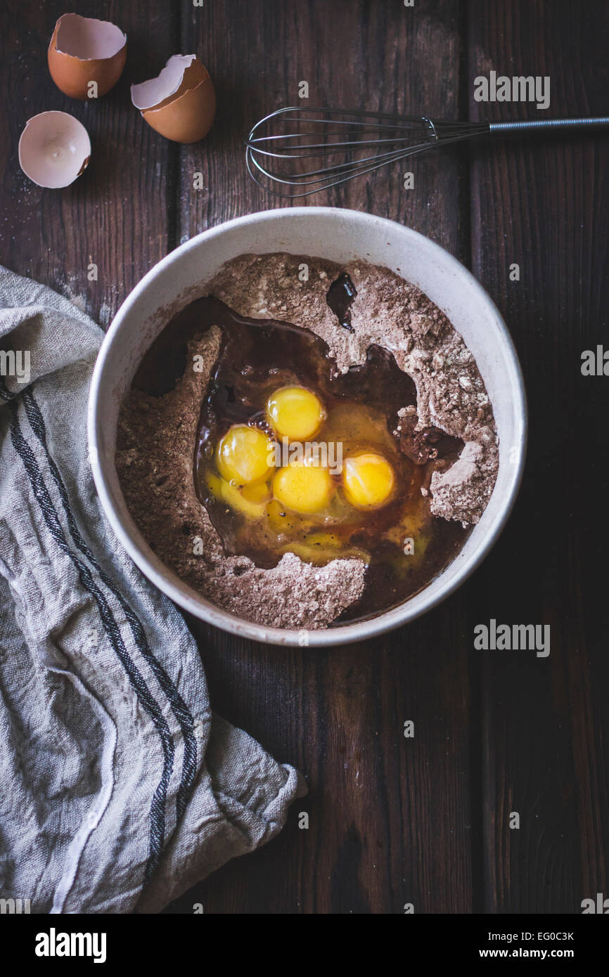 Eggs and cocoa mixture in a bowl Stock Photo