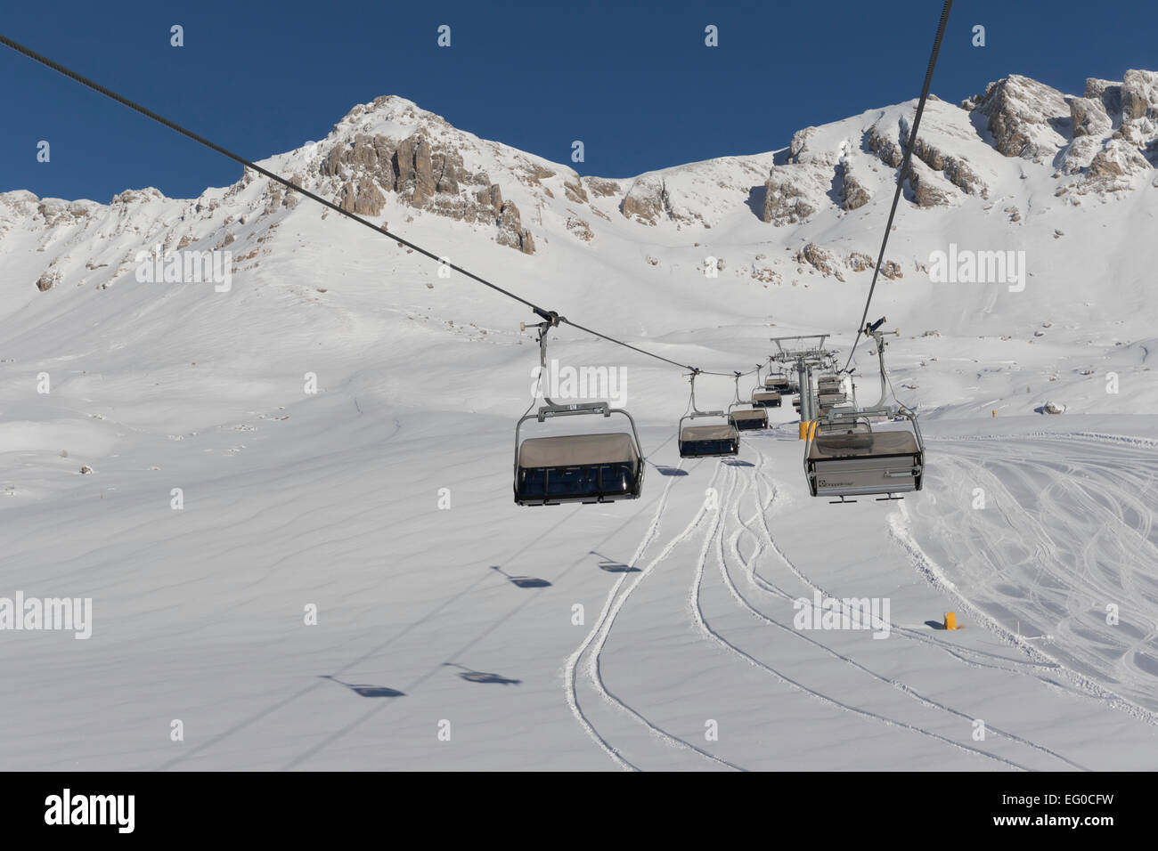Snowboarders riding up ski lift hi-res stock photography and images - Alamy