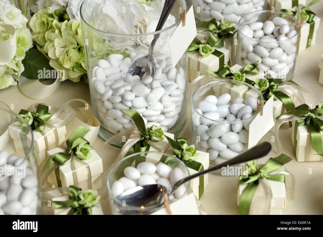 Sugared Almonds on Small Glasses and Small Gift Boxes Stock Photo