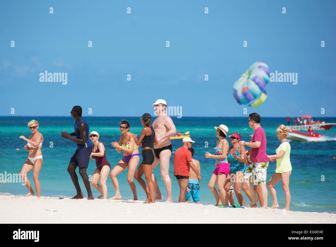 DOMINICAN REPUBLIC. Holidaymakers enjoying a Caribbean dancing lesson on Punta Cana beach. 2015. Stock Photo